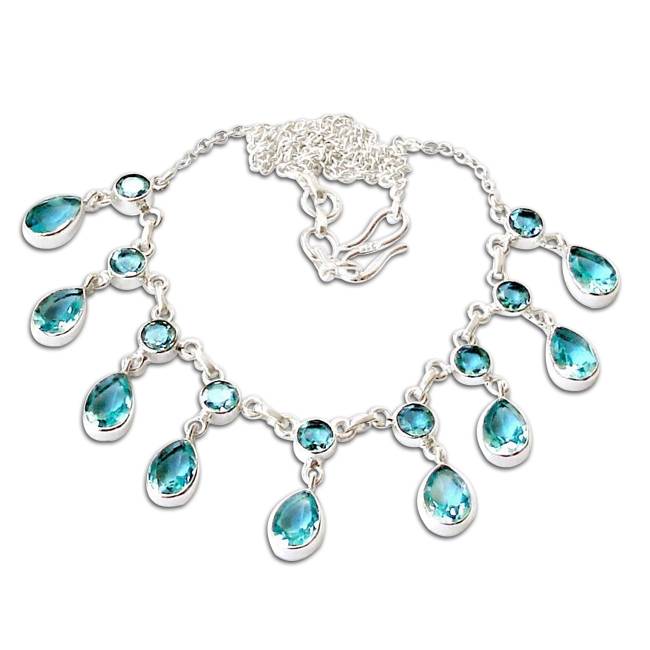 silver necklace with gleaming blue topaz crystals