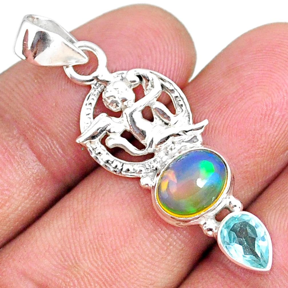 5.24cts natural ethiopian opal oval blue topaz 925 silver angel pendant r75449