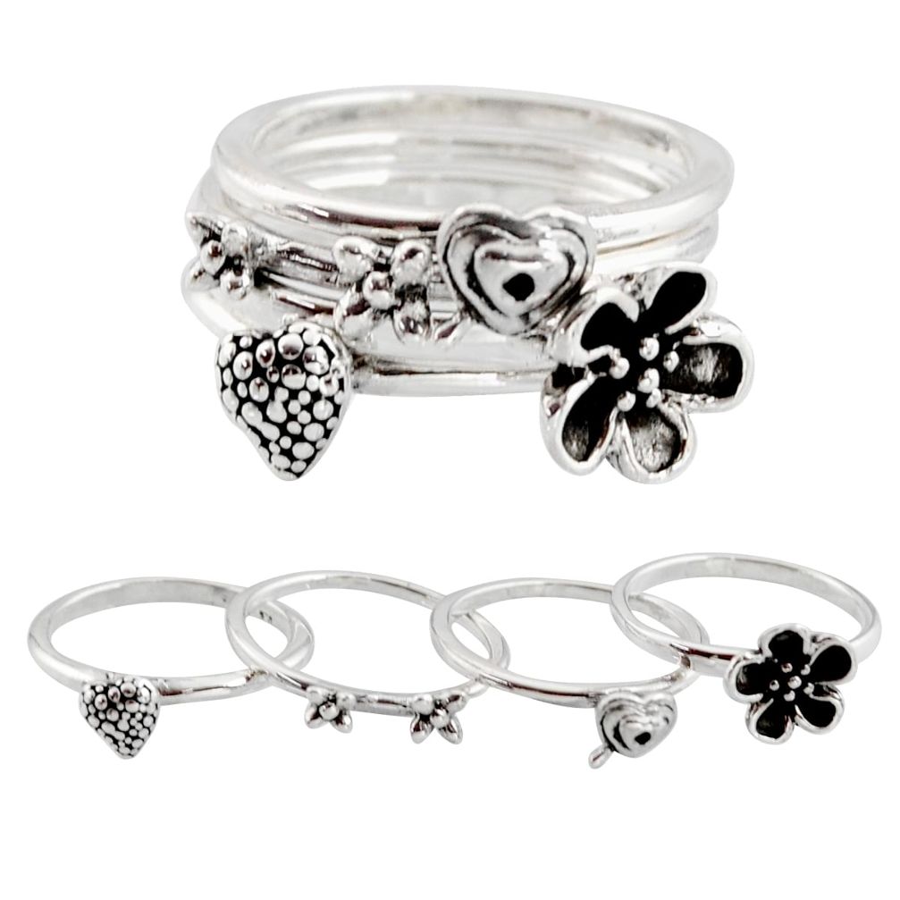 8.89gms stackable charm rings 925 silver flower 4 rings size 7.5 c7697