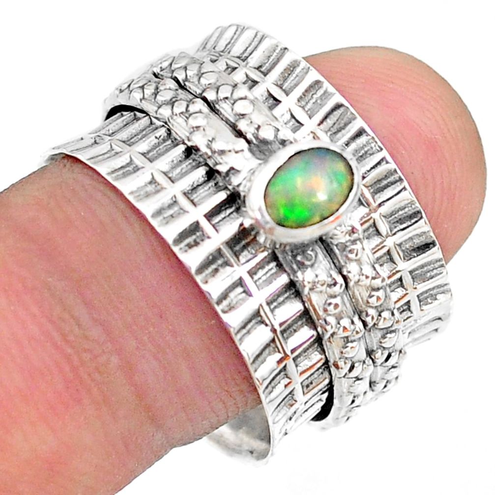 0.74cts solitaire natural ethiopian opal 925 silver spinner ring size 8.5 t31476