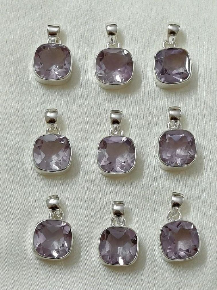 Wholesale lot of 9 Amethyst Cushion Shaped pendants in 925 Sterling Silver.