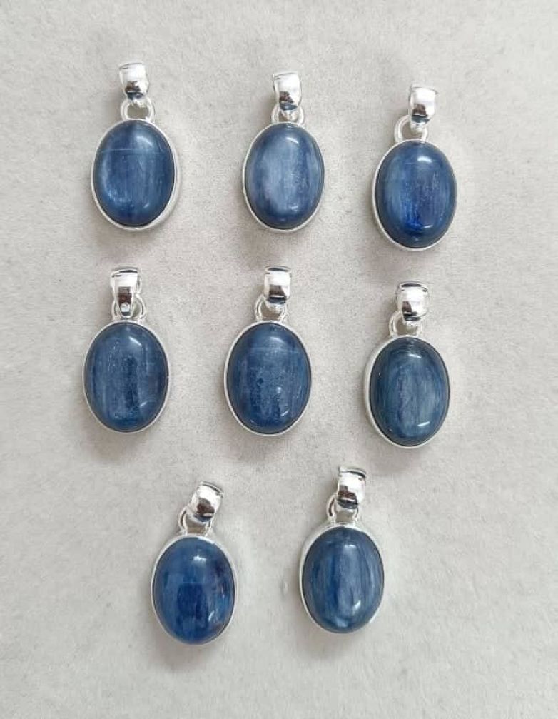 Wholesale lot of 8 Kyanite Oval Shaped Pendants in 925 Sterling Silver .