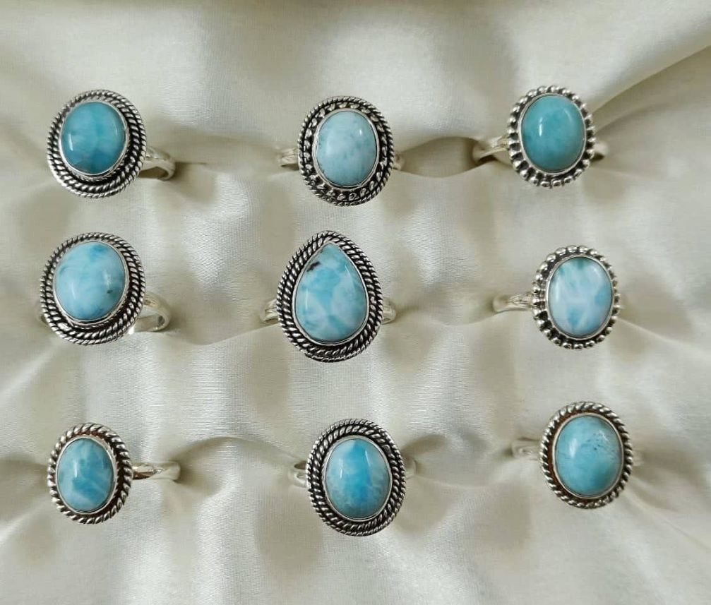 Wholesale lot of 9 Larimar pear and oval shaped rings in 925 Sterling Silver. (Ring Sizes- 6,7,8,9)